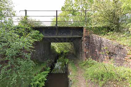 An old, maybe original, metal bridge carrying the track-bed over a drainage channel alongside Holmsley Bog