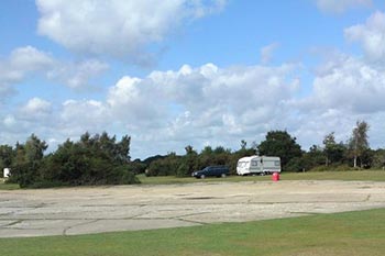 A lone caravan is seen here alongside an aircraft hardstanding within Ocknell campsite (cc-by-sa/2.0 - © dinglefoot - geograph.org.uk/p/1638948)